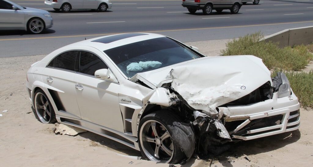 Photo of a Damaged White Car 