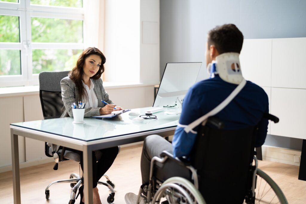 Attorney with an Injured Client Photo of an Attorney with an Injured Client