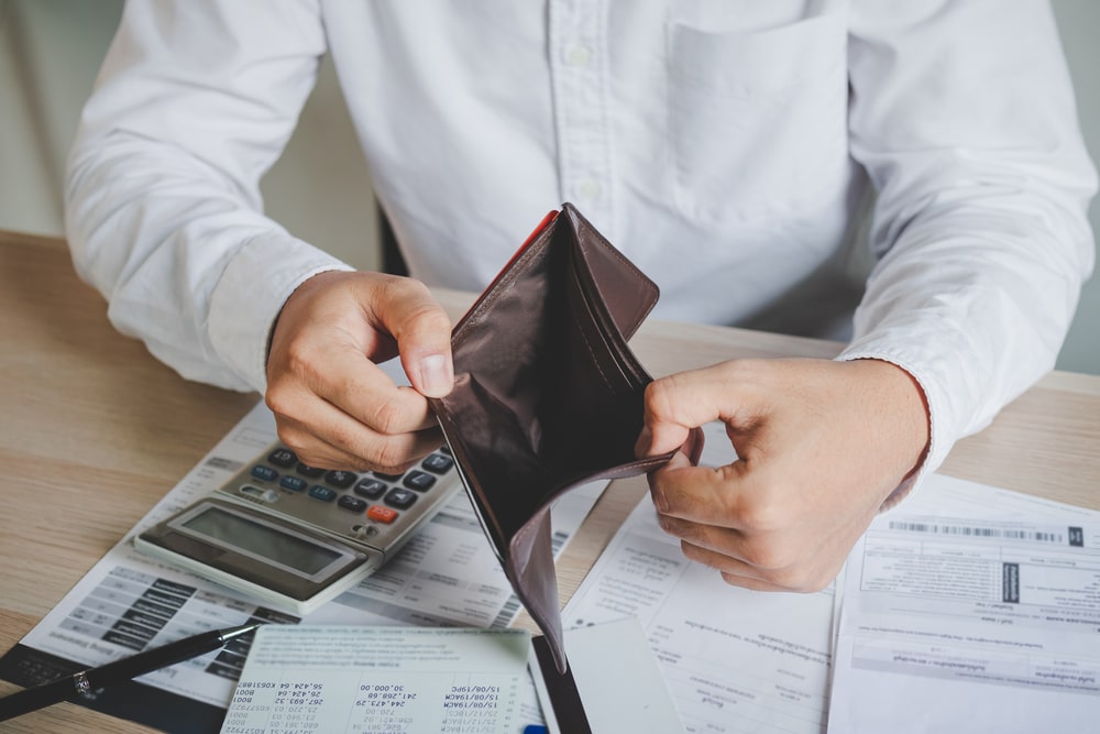 Bankruptcy Man Showing An Empty Wallet